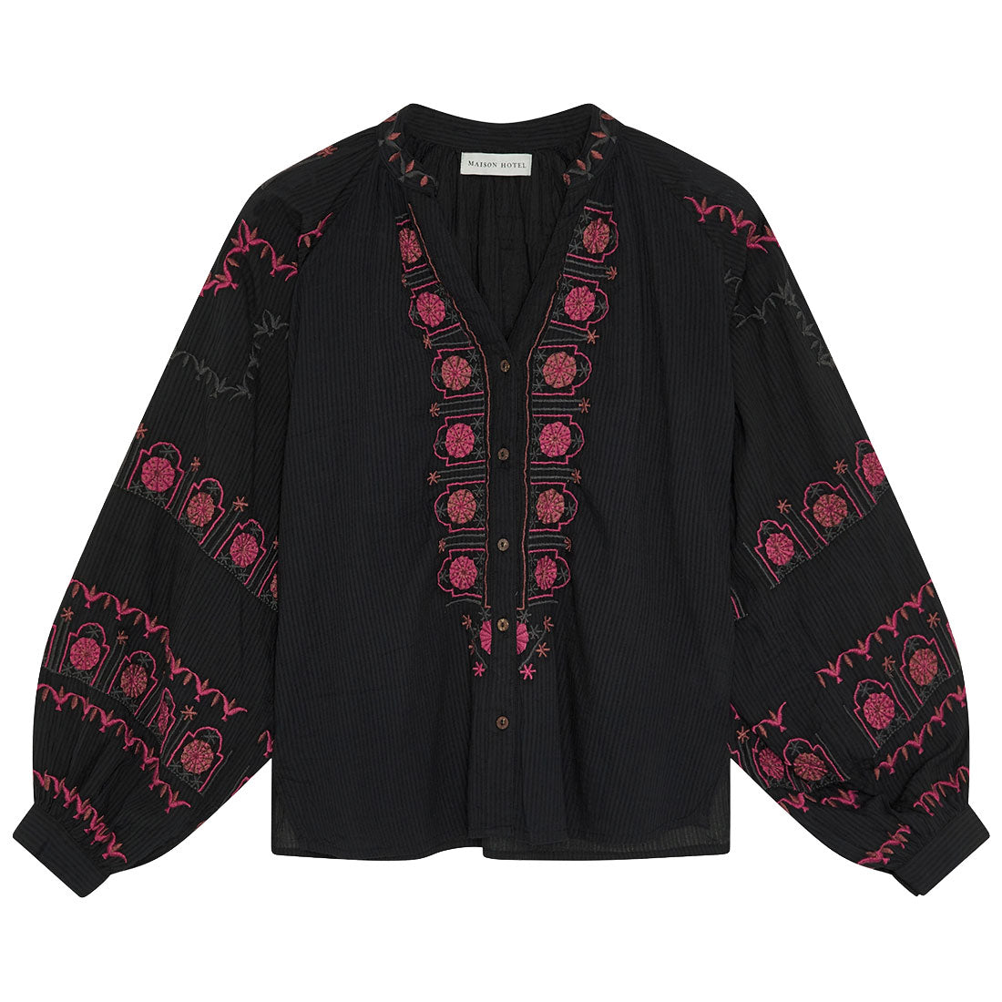 A black long-sleeve button-up blouse with pink embroidered floral and arch motifs, laid flat against a white background.