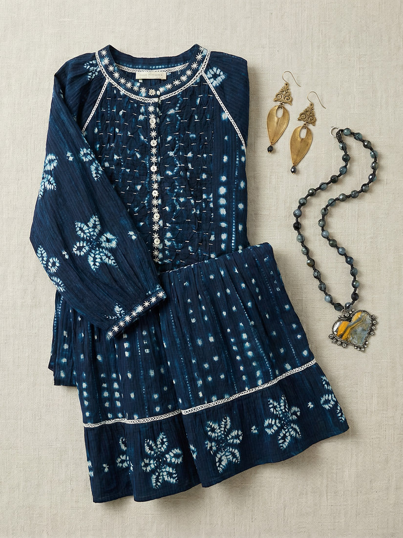 kumo maxi dress flat lay with jewelry from maison hotel