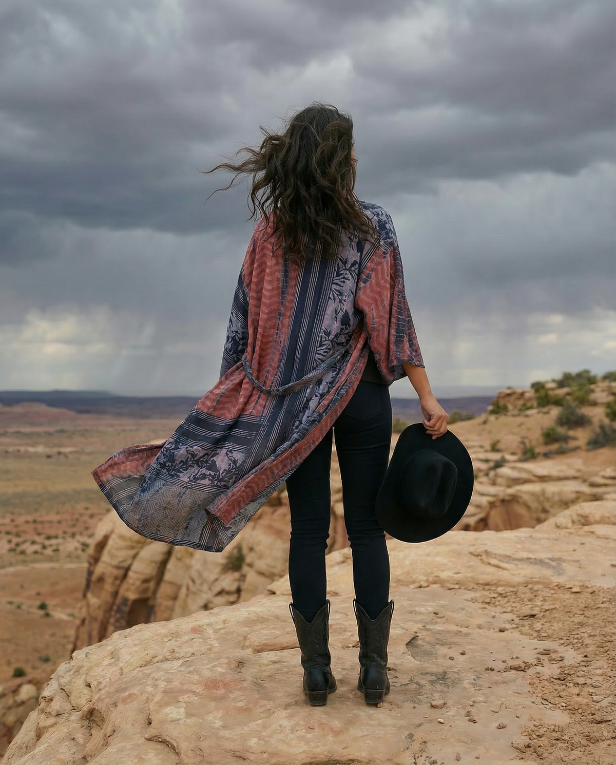 women in copper and black kimono in the desert video