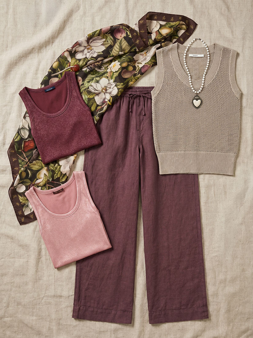 Collection of clothing items including tank tops, pants, and a vest on a neutral background