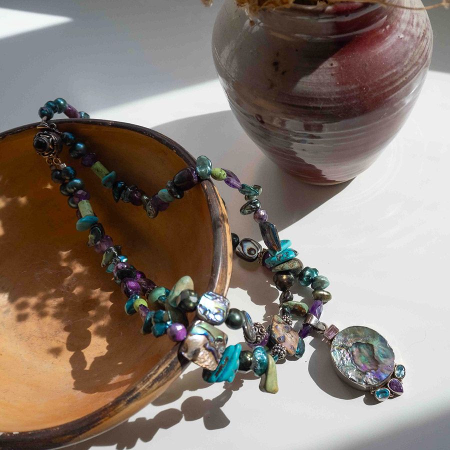 cusco amethyst gemstone necklace on table close up