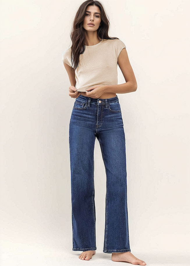 GDC dark denim high rise wide leg jeans on brown hair model