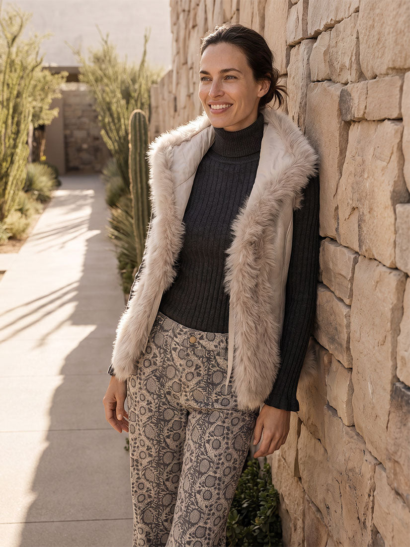 dark haired woman wearing beate heymann fuax fur vest