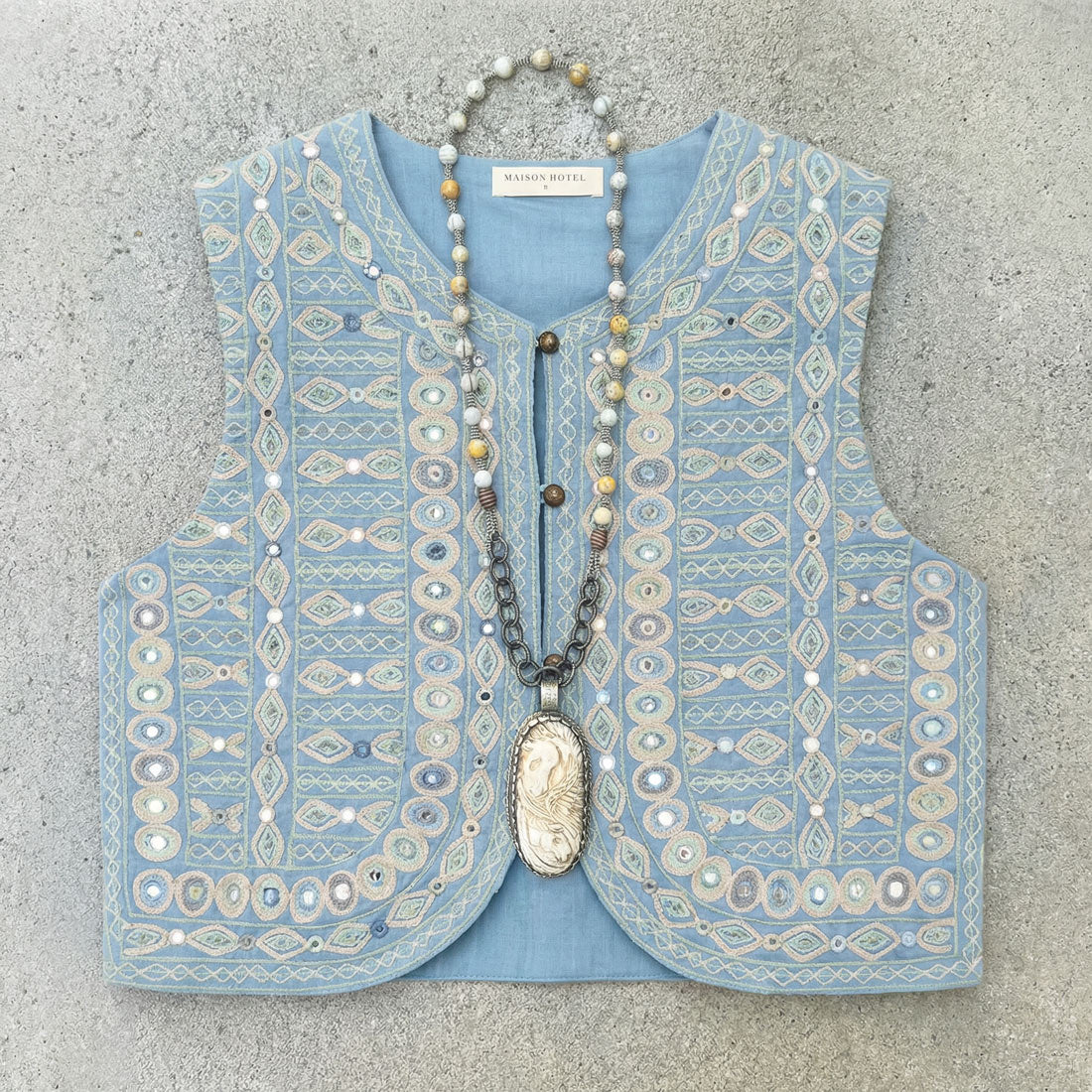 treasure embroidered vest from maison hotel and necklace from zowee