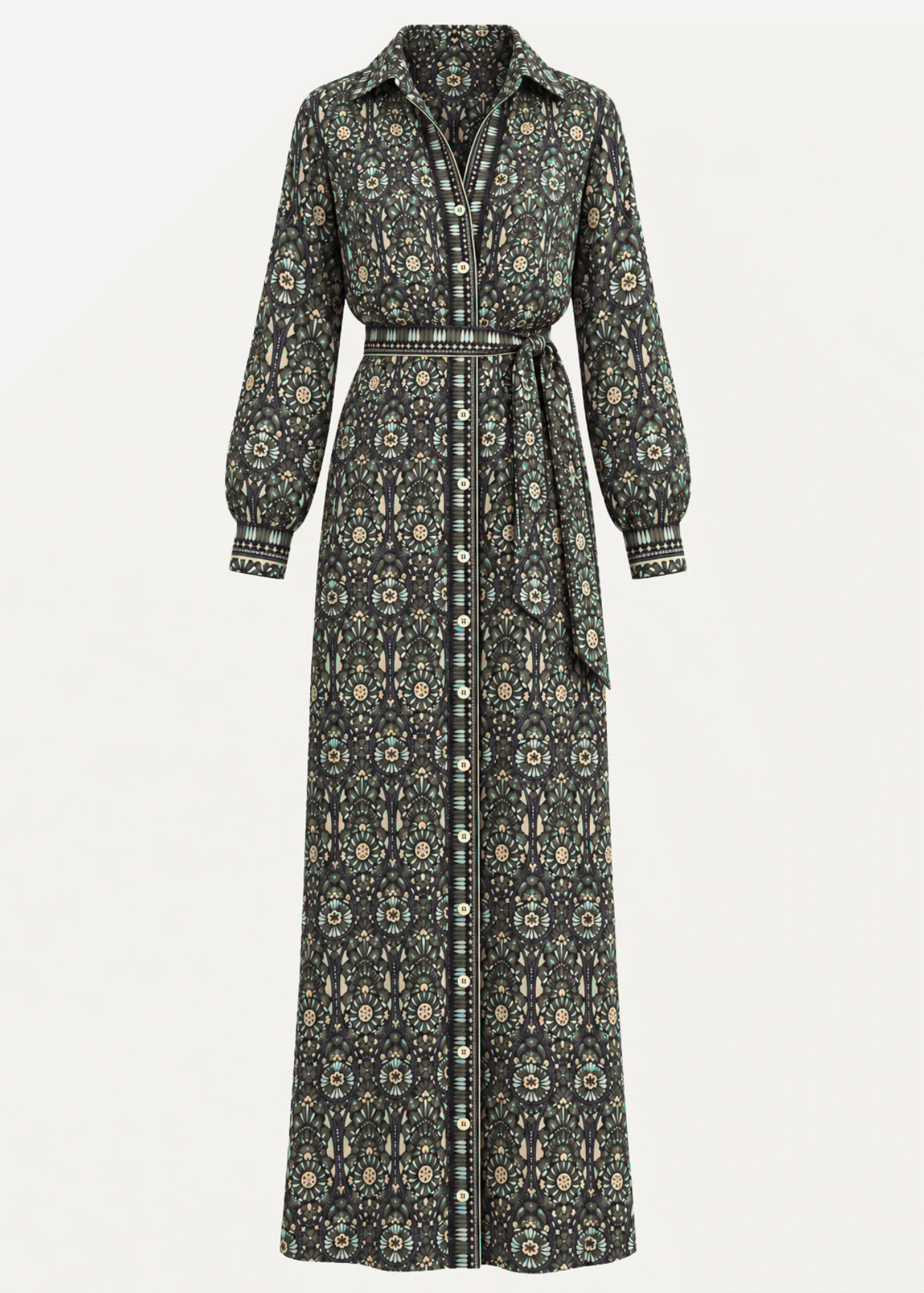 A long-sleeve omika maxi shirt dress with a button-front closure, collar, and self-tie belt, featuring an all-over geometric and floral pattern in muted green, beige, and cream tones, shown against a plain off-white background.