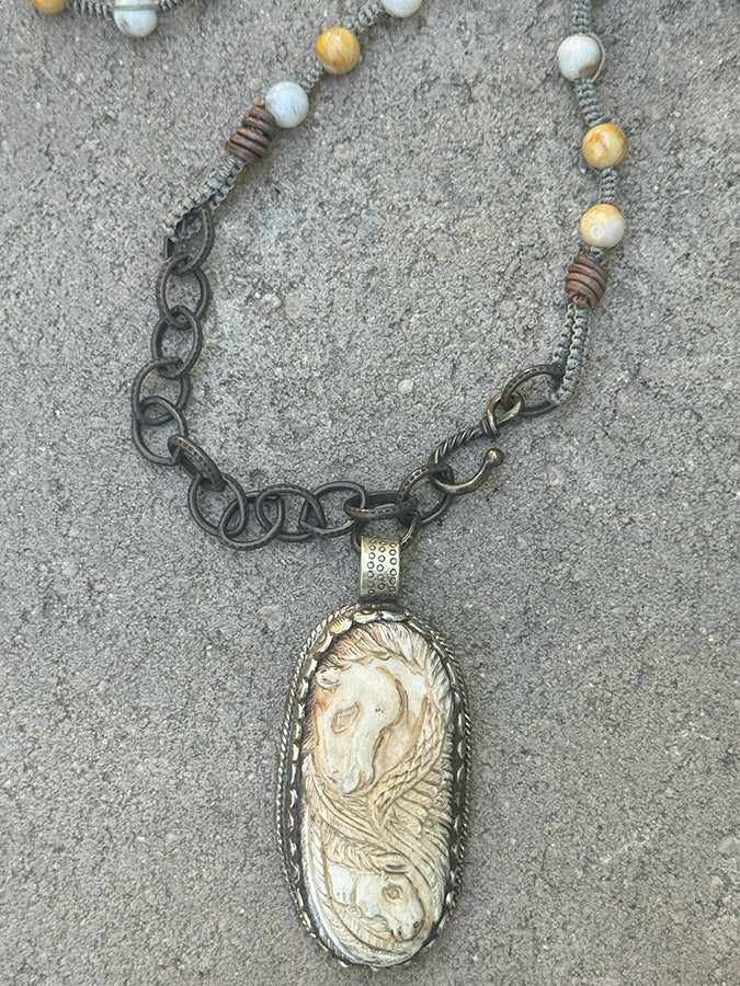 pegasus carved pendant necklace close up